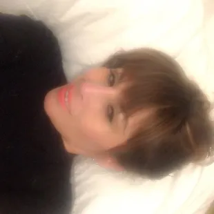 a woman laying on a bed