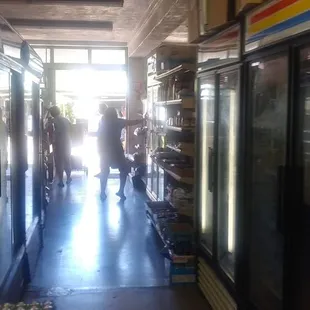 people walking through the store