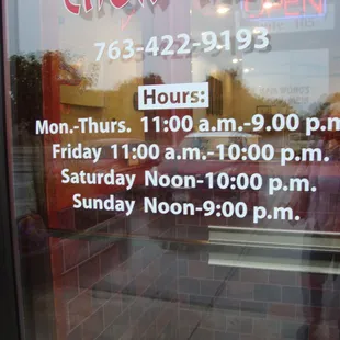 Hours of operation, front entry door.