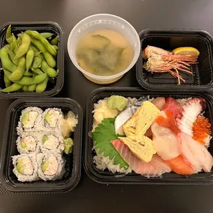 Take out- On the left: Edamame, California Roll. On the right: Deluxe Chirashi Don