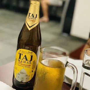 a bottle of beer and a glass of water