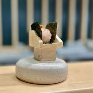 a sushi box with sushi in it