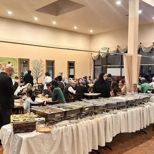 a group of people at a buffet table