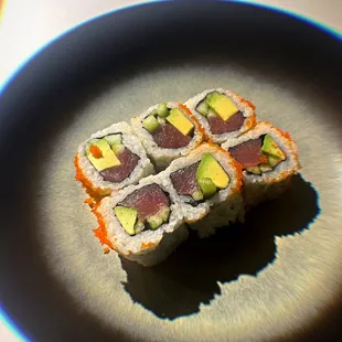 two pieces of sushi on a plate