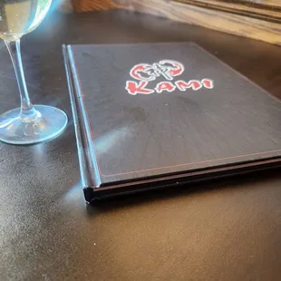 Glass of wine and menu