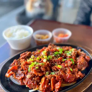 Daeji Bulgogi: Spicy Pork w/ rice, banchan: soy bamboo shoots &amp; kimchi | $27.99 (one outdoor table)