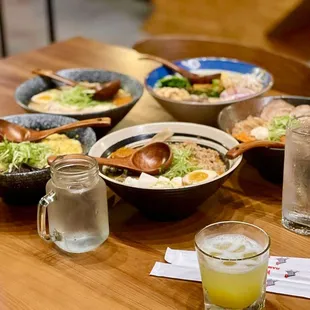 bowls of ramen and a glass of water