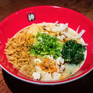 a bowl of ramen and broccoli