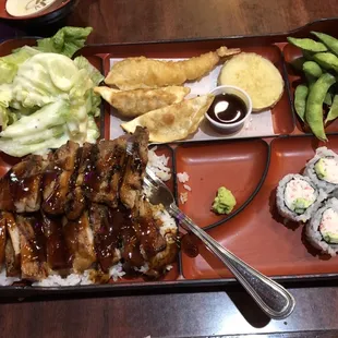 Chicken teriyaki with rice, salad, tempura, sushi rolls and edamame. Not pictured is the miso soup