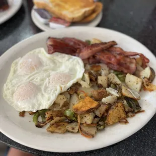 Eggs bacon and breakfast potatoes. Everything was well cooked. Eggs over easy.