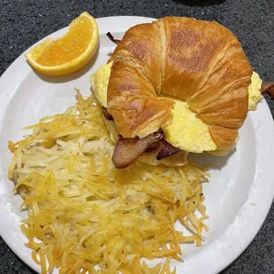 Breakfast sandwich, side of oily Hash Browns and &quot;side of Fresh Fruit&quot;