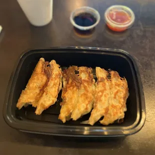 YAKI Shrimp Gyoza. 6 pieces for $9.50. Included ponzu + extra sauce for dipping. Sweet chili shown.