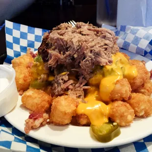 Loaded tater tots with bacon, cheese, jalapeno&apos;s and I added beef brisket....cuz &apos;Muerica.