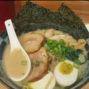 Pork Chashu in Pork broth, with soft boiled egg, scallions, bamboo shoots, bean sprouts, and seaweed
