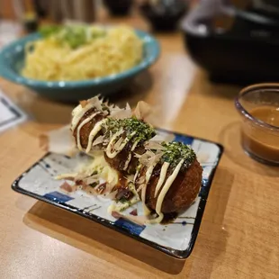 Takoyaki  (octopus) were so fresh and creamy on the inside, perfectly seasoned and dressed