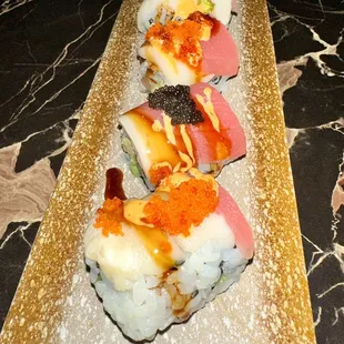 a sushi platter on a marble table