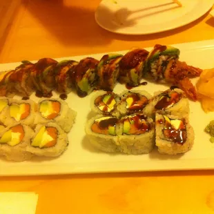 Clockwise from top: super dragon roll, garden roll, and honey roll; Kamiza