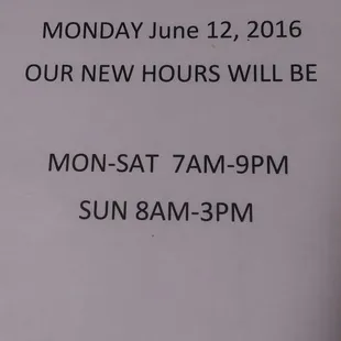 a sign for the new hours