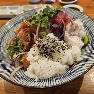 Salmon + Tuna Poke Bowl with 1/2 Salad + 1/2 Sushi Rice.  It's like a deconstructed sushi roll + a salad.