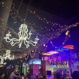 a restaurant decorated with christmas lights