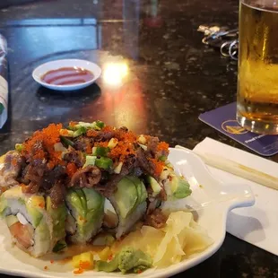 A crazy Jonathan. Lol. Doesn't exist on the menu. Its an irene roll with mangos, jalapeños,,beef and tobiko. With a Sapporo.