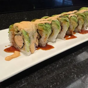 OMG roll. Baked salmon with avocado,spicy mayo, and eel sauce on top.