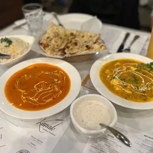 The spread - Butter Chicken, mango curry special (paneer), raita, garlic basil naan - IG @bougiefoodieboi