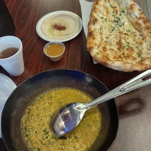 Mash daal, garlic naan, complementary hummus, sauce, free hot tea