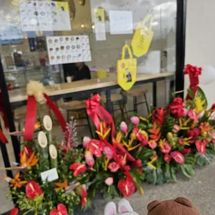 Congratulatory bouquets outside of the restaurant