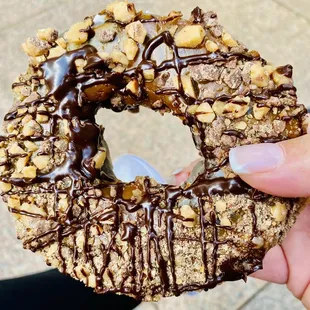 Turtle. One bite of chocolate donut with chocolate &amp; caramel sauce and almonds OMG