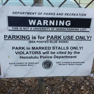 They installed these signs in the park parking lot, to make sure students from UH don't park here!