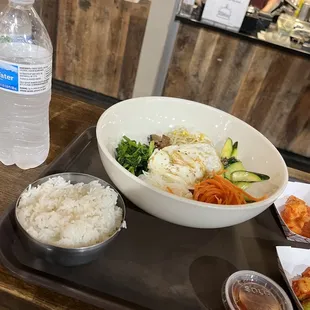 a bowl of rice and a bowl of vegetables