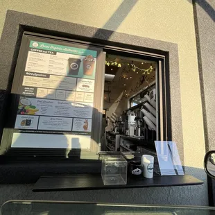 a cup of coffee and a menu