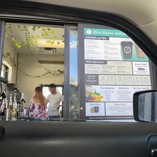 a woman and a man in a car