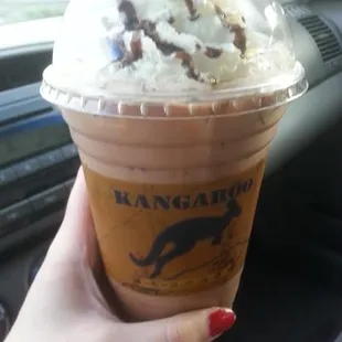 Yummy iced coconut mocha with whip and chocolate drizzle.