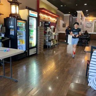the inside of a restaurant with tables and chairs