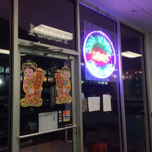 Nice sign on the front door. You can see the kitchen from the front door.