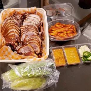 Jokbal came with lettuce, radish kimchi, and some condiments.