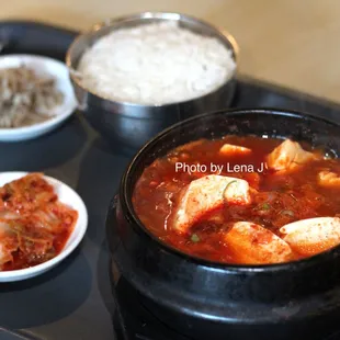 Soon Tofu Jigae ($12.25) - Soft tofu, pork, vegetables and mixed seafood in spicy hot broth served with egg