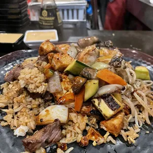 a plate of rice and vegetables
