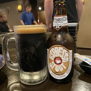 a bottle of beer and a glass of beer