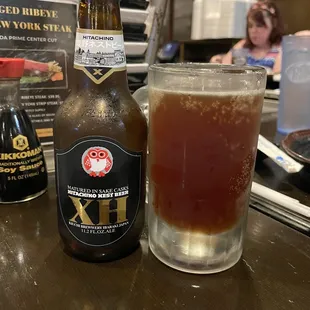 a glass of beer and a bottle of beer