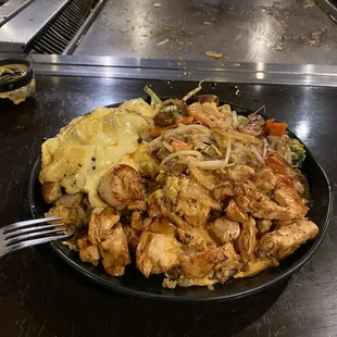 Chicken, scallops with egg yoke sauce, fried rice, vegetables. Hot off the grill.