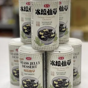 a stack of four cans of food