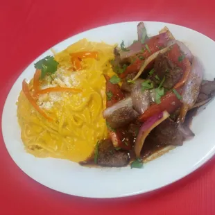 a plate of food on a red table