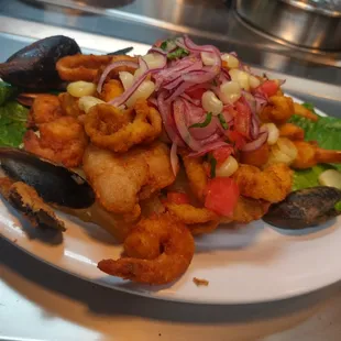 a plate of seafood and salad