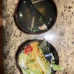 a bowl of soup and a bowl of salad