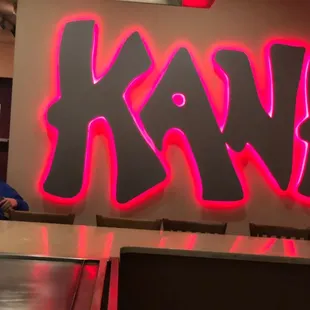 a neon sign in a restaurant