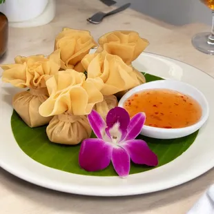 Golden pouch, very unique appetizer stuffed marinated chicken wrapped in golden wonton skins.