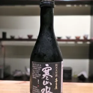 a bottle of sake on a table